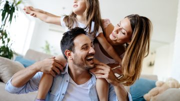 Happy family having fun times at home together